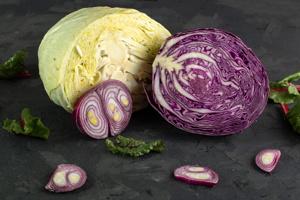 Neatly arranged ingredients for a vibrant ramen cabbage salad dressing, captured in a close-up still life photograph. In the foreground, a glass bowl overflows with fresh, crisp green cabbage, shredded into thin strips. Surrounding the cabbage, a variety of essential seasonings and aromatics: juicy wedges of lime, sliced green onions, fragrant sesame seeds, and a rich, amber-colored sesame oil. The midground features a stainless steel mixing bowl, hinting at the impending tossing and blending of these flavorful elements. Soft, natural lighting casts gentle shadows, emphasizing the texture and freshness of the ingredients. A simple, uncluttered white backdrop allows the vibrant colors and textures to take center stage, evoking the satisfying crunch and bold flavors of the perfect ramen cabbage salad dressing.