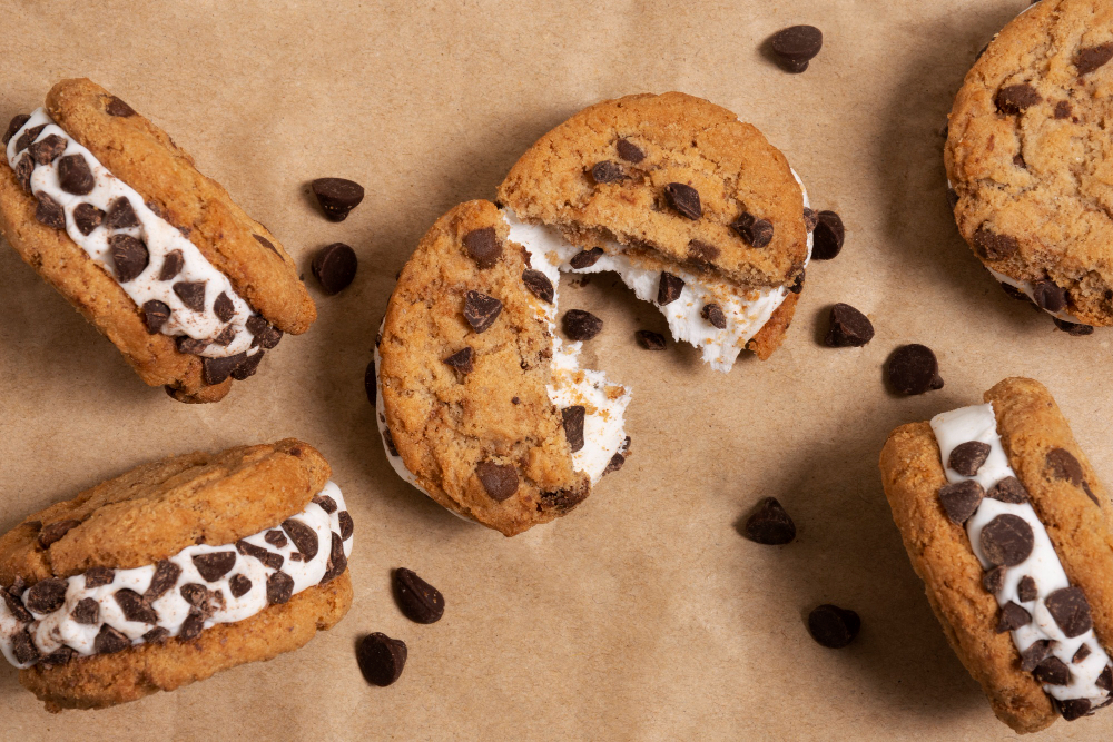 Create an image of gluten-free ice cream sandwiches made with dairy-free ice cream and chocolate biscuit-style cookies. milk free desserts