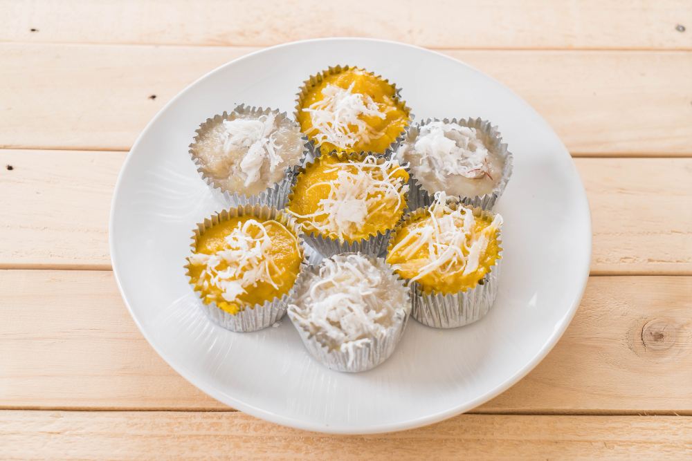 Generate an image of mango coconut truffles with a creamy coconut center and a vibrant mango exterior. milk free desserts