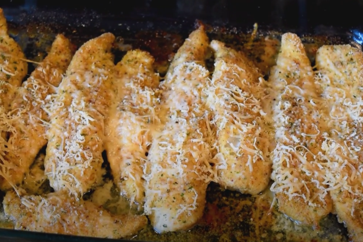 Image of parmesan crusted walleye fillets on a baking sheet Baked Walleye
